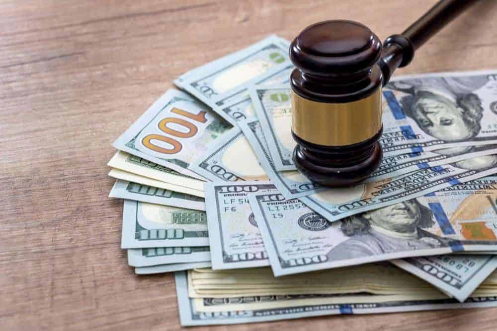 Wooden gavel with usa dollar on desk