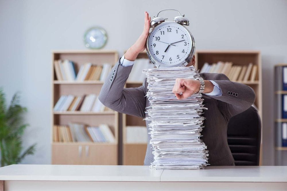 Employee busy with paperwork in office